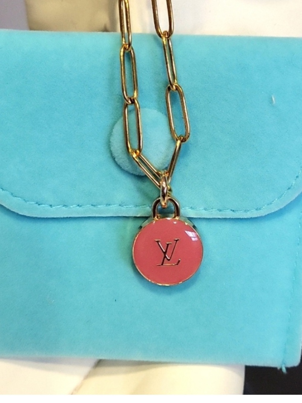 Luxury necklace with a repurposed LV bag charm